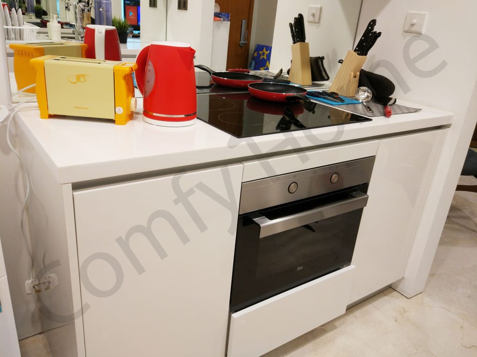 Kitchenette that comes with fridge and water filter.