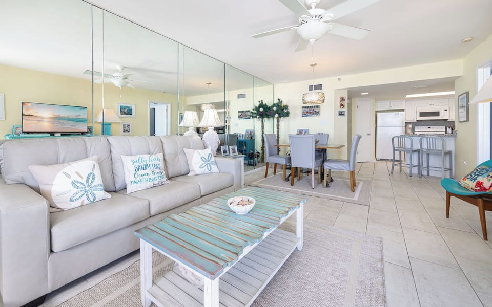 Relax on the plush sofa in the living room while streaming your favorite show after a day on the coast