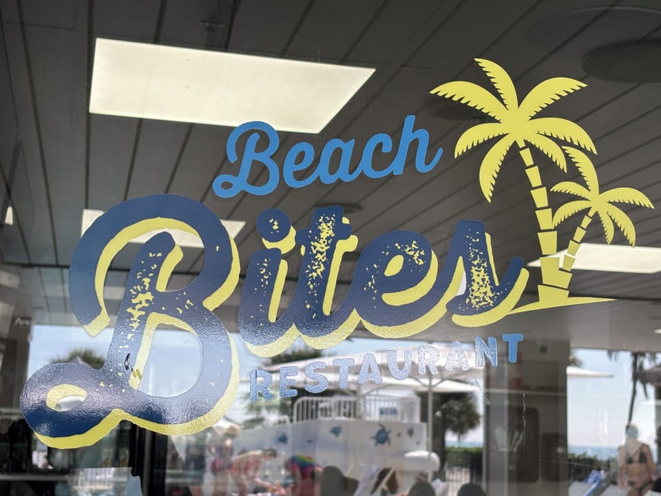 Pizza and ice cream near the tiki bar and TVs. Open to the public.