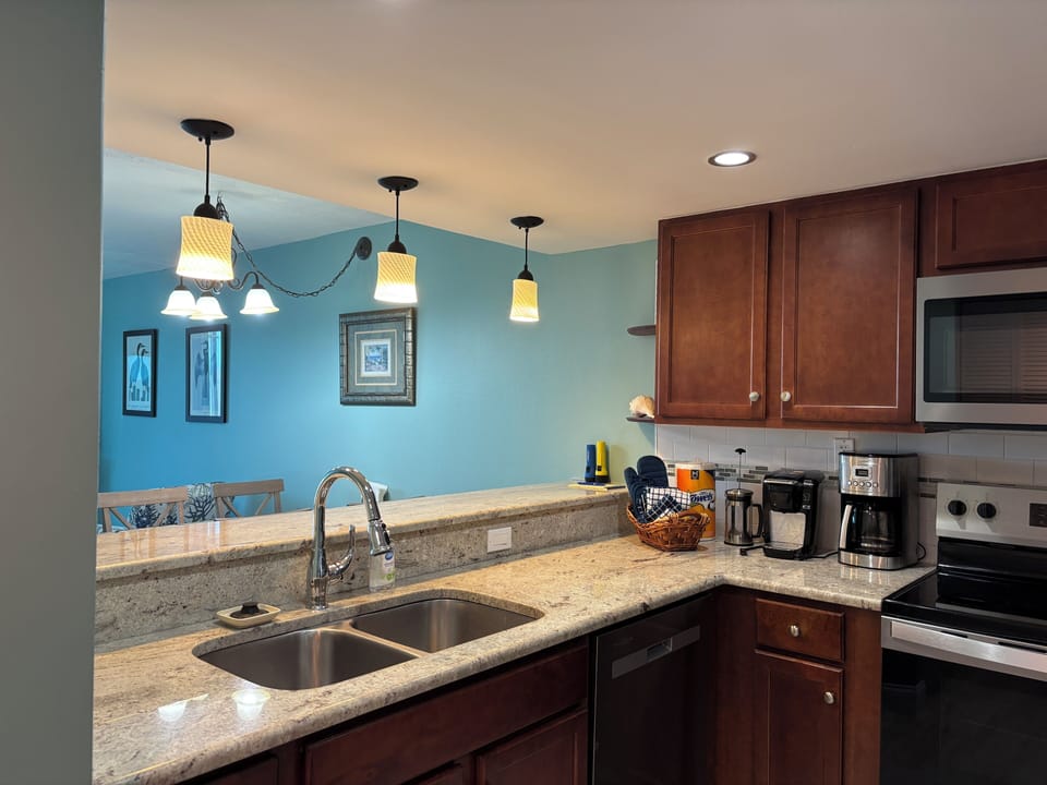 Well stocked kitchen. Sink has a view of the Gulf.
