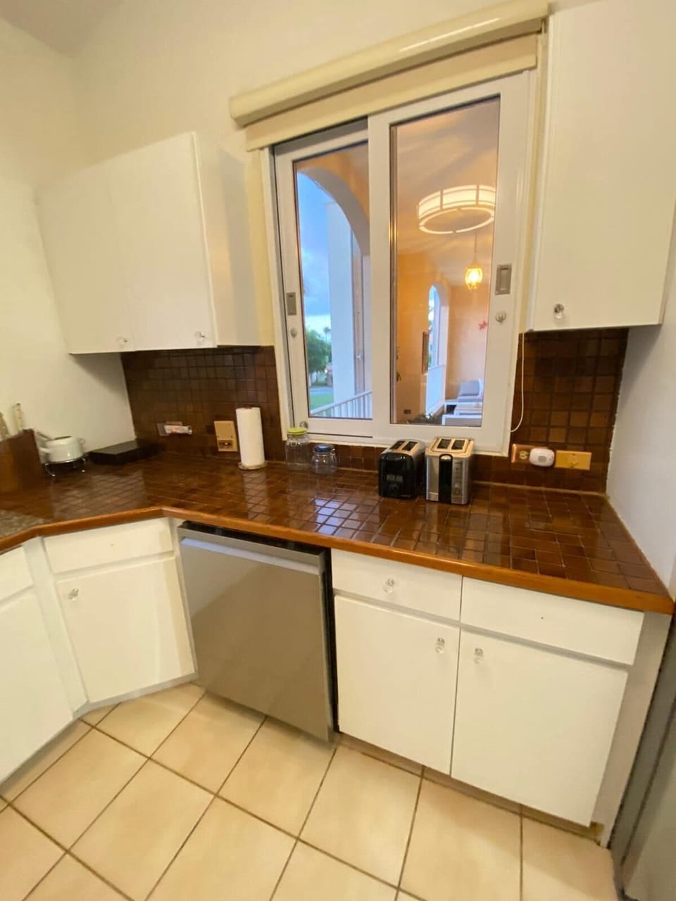 Kitchen with a window for fresh air and daylight while preparing food