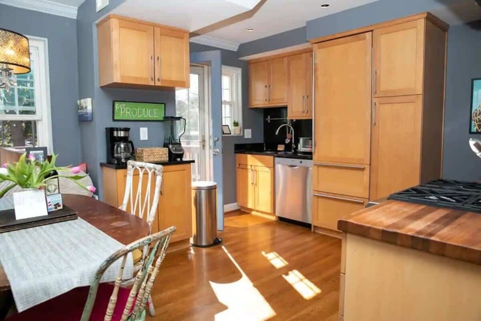 Wide open kitchen with door to deck and patio below
