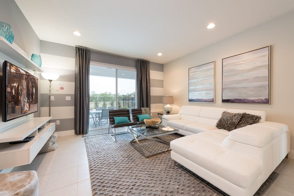 Living room with sliding doors to private  pool and spa.