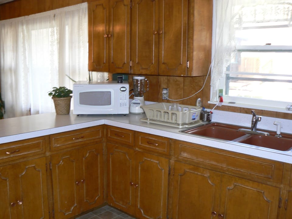 the kitchen with all the basic pots, pans, dishes ect. that your family needs