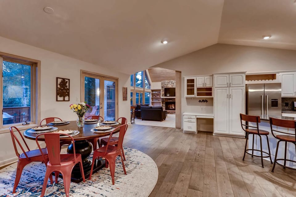 Open floor plan with dining/kitchen areas open to living