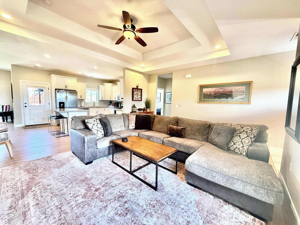 The living room with comfortable furniture is the perfect spot to gather with friends and family!