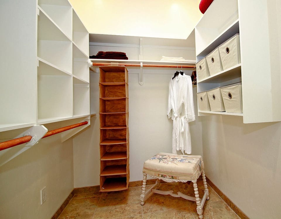 Master walk in closet, robes provided