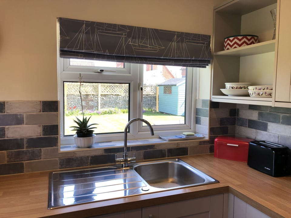 Kitchen - looking through the window into the back garden