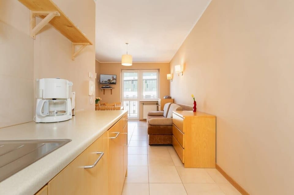 Another view of the kitchen, showcasing the modern appliances and organized layout, which maximizes the functionality of the room.