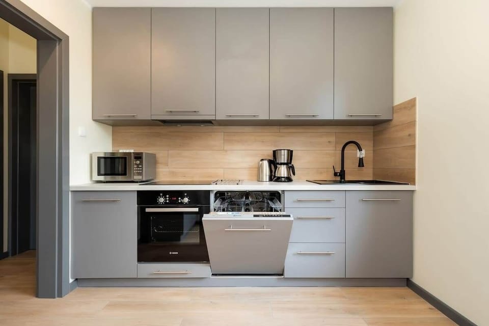 Kitchen with oven and refrigerator. 