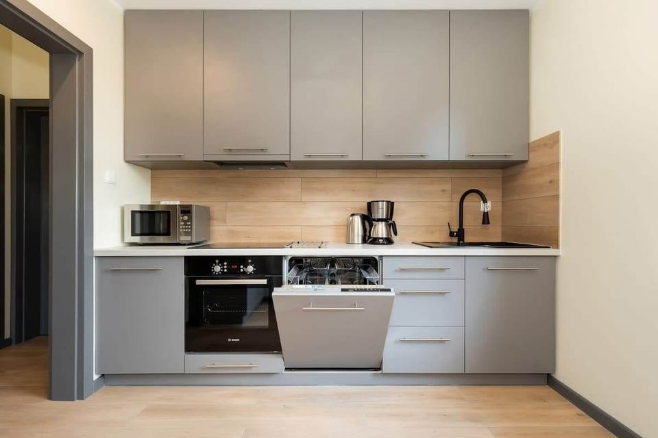 Kitchen with oven and refrigerator. 