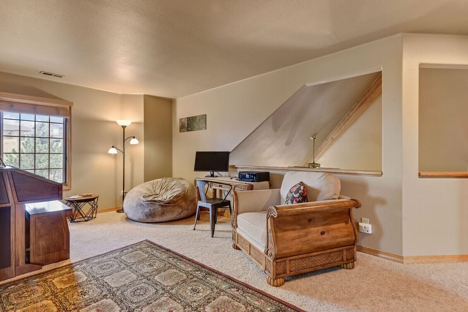 Upper level loft at top of stairs. Organ and small desk w/printer and monitor.