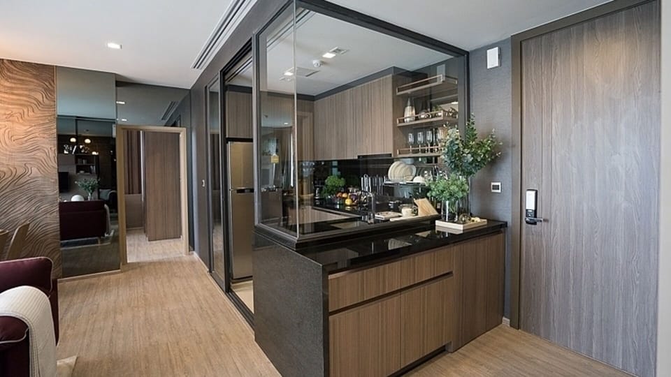Open kitchen with half height glass wall.