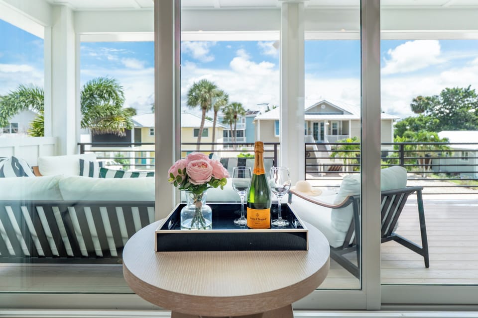 Bubbly, blooms, and a patio view vacation mode on!