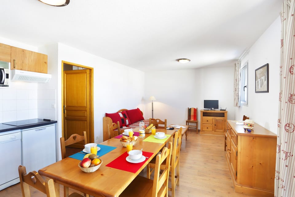 Prepare meals in the kitchenette and enjoy them at the dining table.
