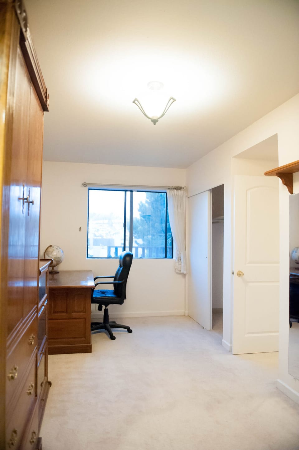 Master bedroom facing the back yard with a great view