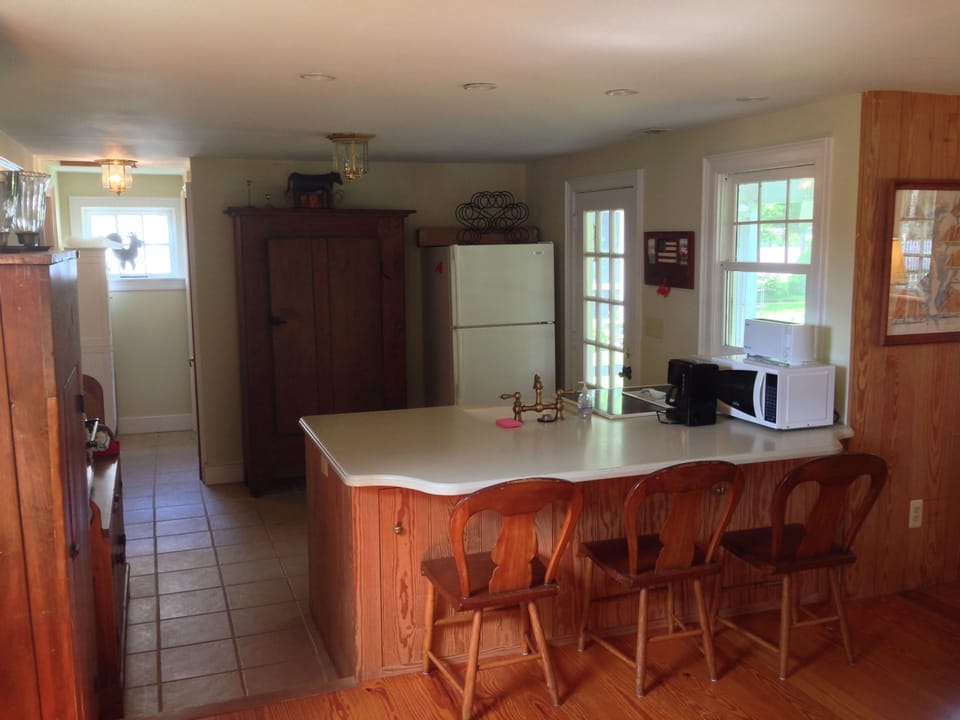 Kitchen area from Family room with door to rear porch