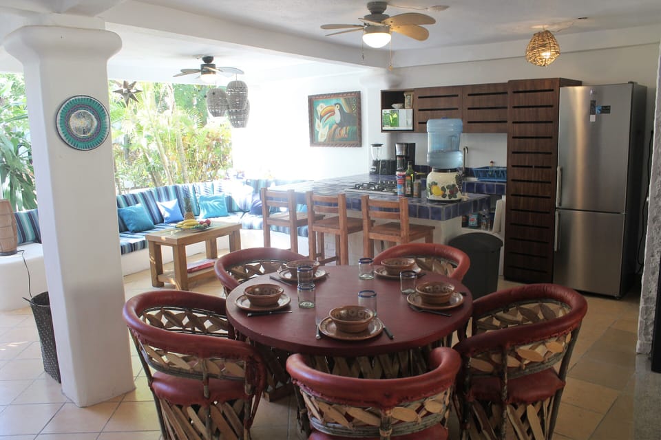 Lower level dining, kitchen and seating area.