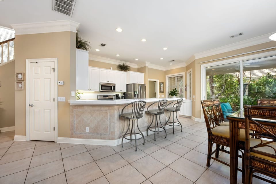 Open living room to bar and dining