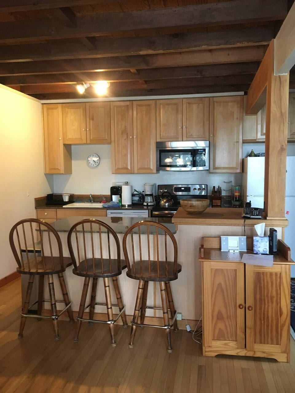 Open concept kitchen with additional bar seating. 