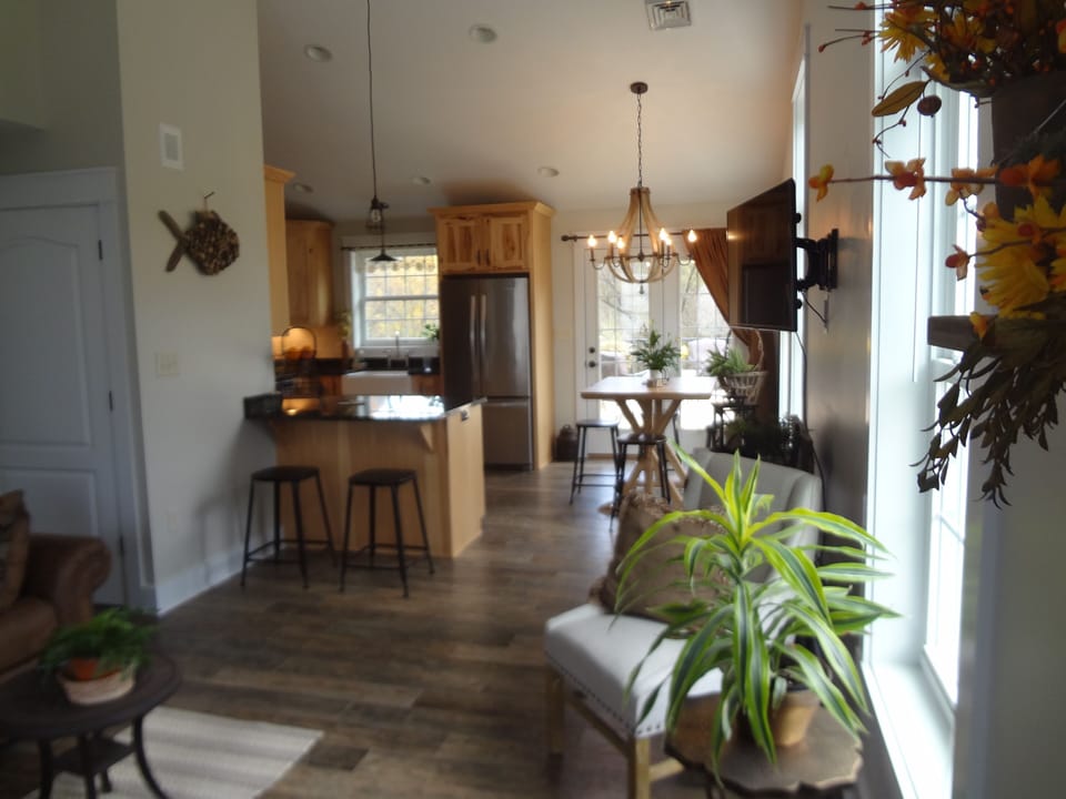 OPEN LIVING SPACE from living area to kitchen.  French Doors open to Large Deck