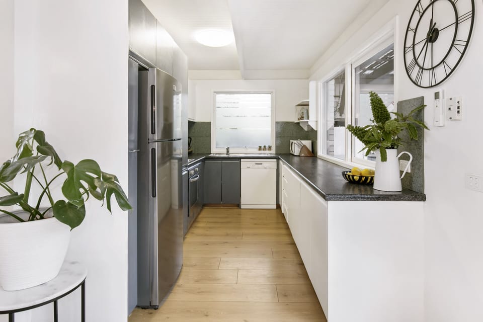 Newly refurbished kitchen with new stovetop, oven and a new fridge