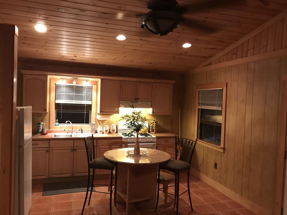 Kitchen . Large fridge and 4 hand weaved wicker stools not pictured. Fully stock