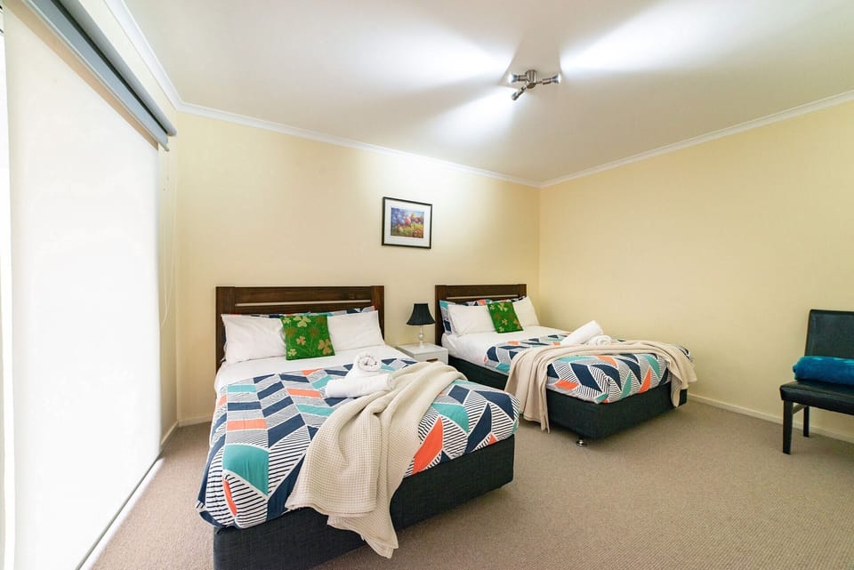 Downstairs retreat: Two bedrooms, double-size beds. Cozy and inviting for restful nights.