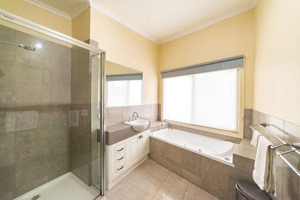 Upstairs bliss: Well-appointed bathroom for comfort and convenience.