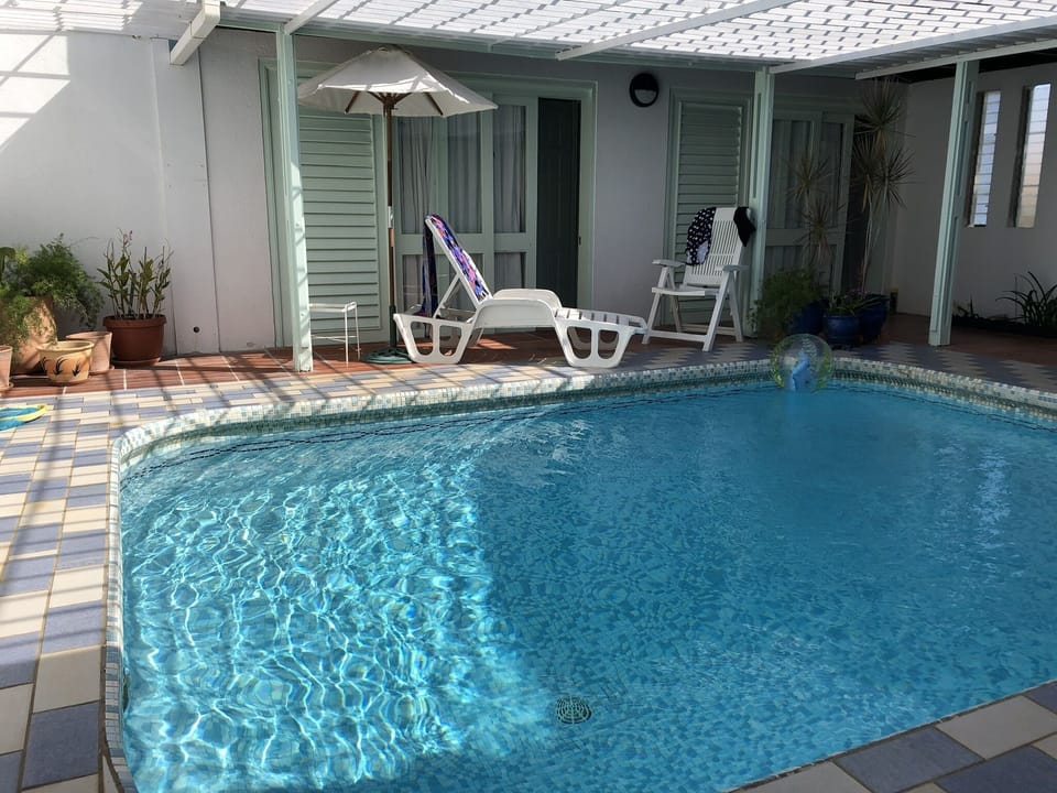 A view across the patio and swimming pool 