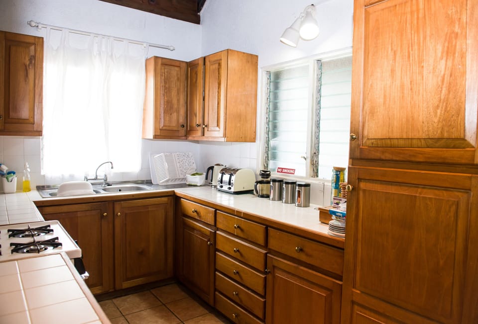 Fully fitted kitchen in local Grenadian cedar wood