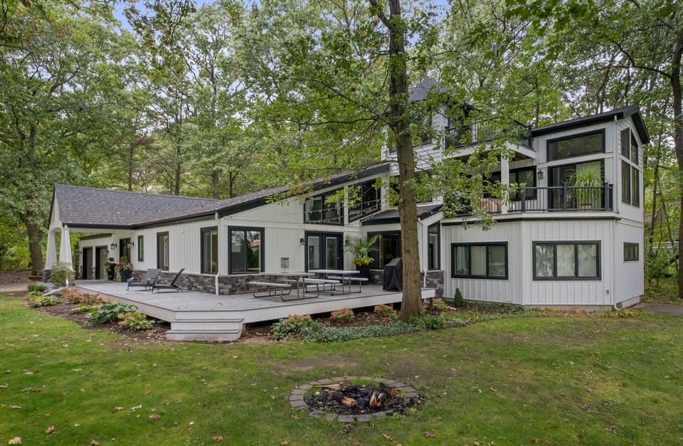 Front and east side of house with fire pit.