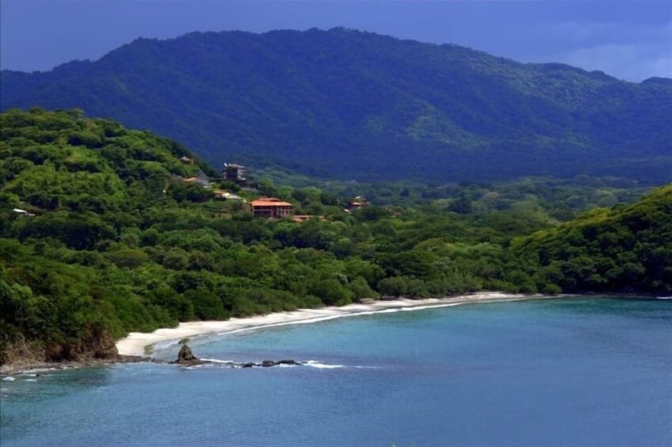 View of the hillside and beach where we are located