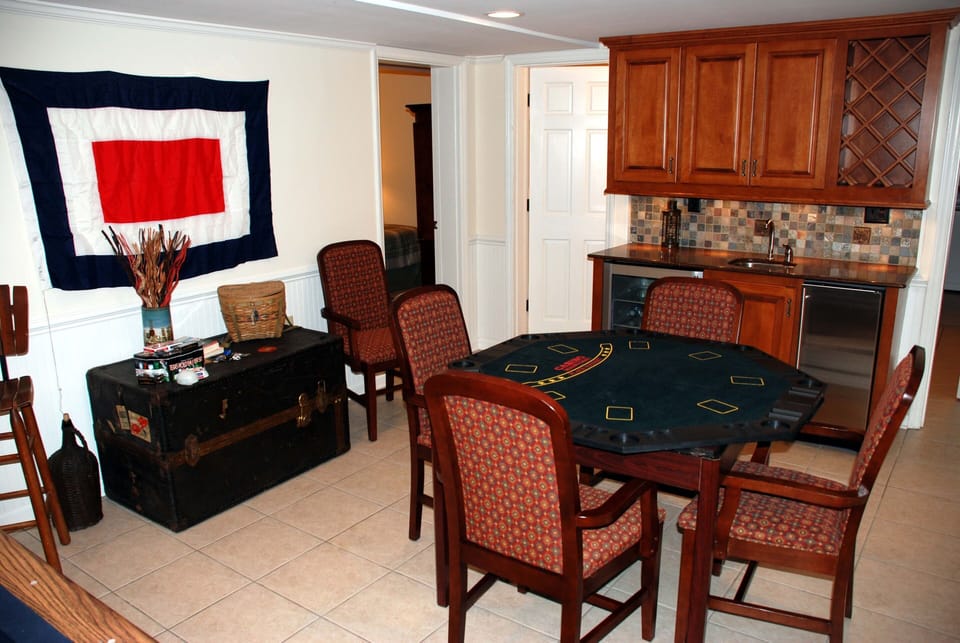 Lower lvl: game table,wet bar,ice maker,bev ctr.  4th bdrm & 3rd bath in backgrd