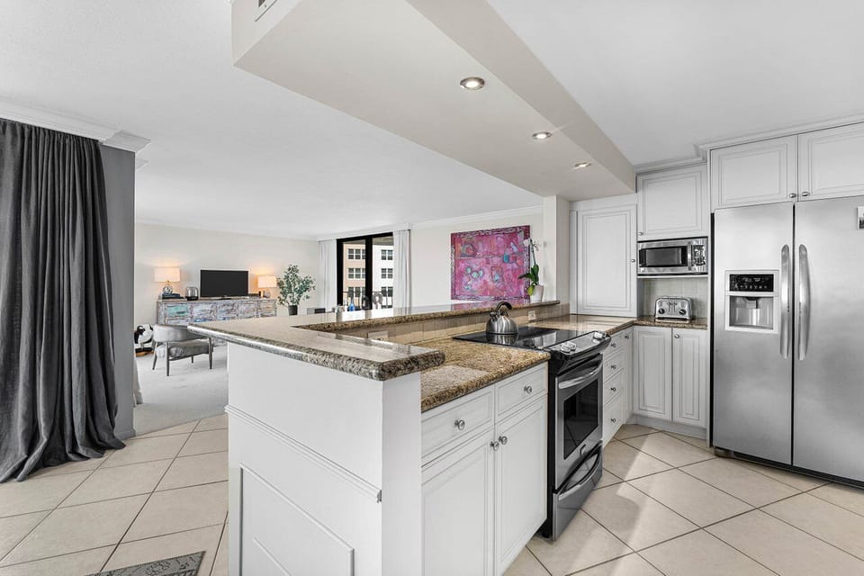 Well Equipped Kitchen With Stainless Steel Appliances.  