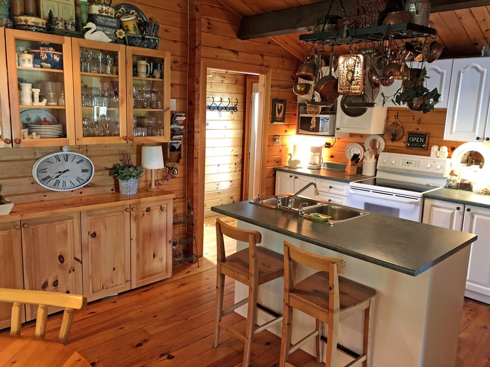 Kitchen with large hutch and front entrance