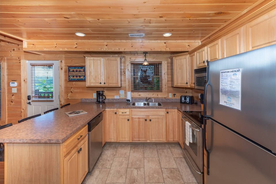 The kitchen is stocked with essentials to cook family meals, as well as a standard 12 cup coffee maker & Keurig!