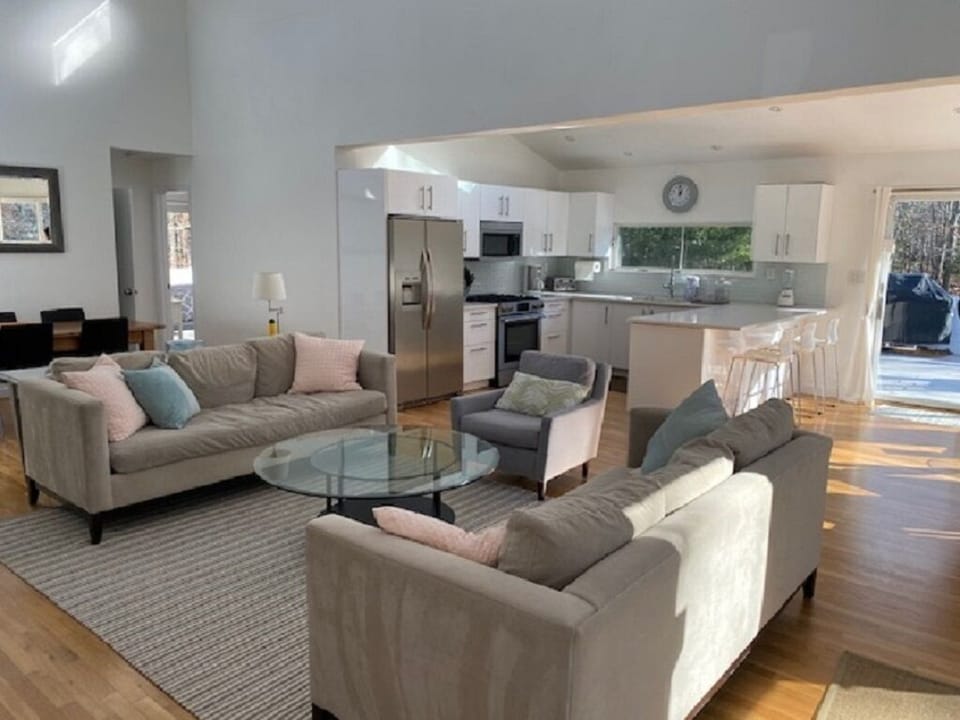 modern living area with 65” flat screen tv