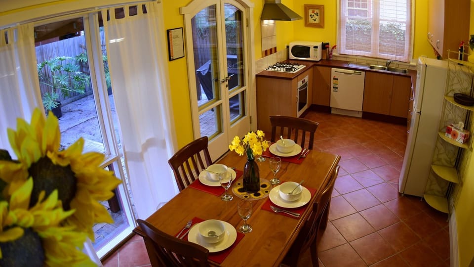 Fully equipped kitchen with dishwasher and microwave.