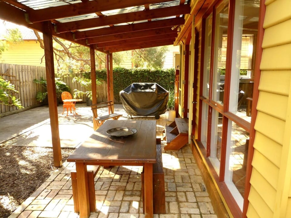 Outdoor dining with Gas BBQ and plenty of room to hang out. Fully enclosed.