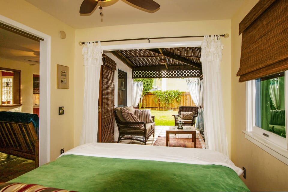 Bedroom opens out into cabana room and yard through double french doors