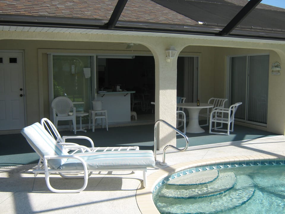 Great pool area with lanai and grilling area