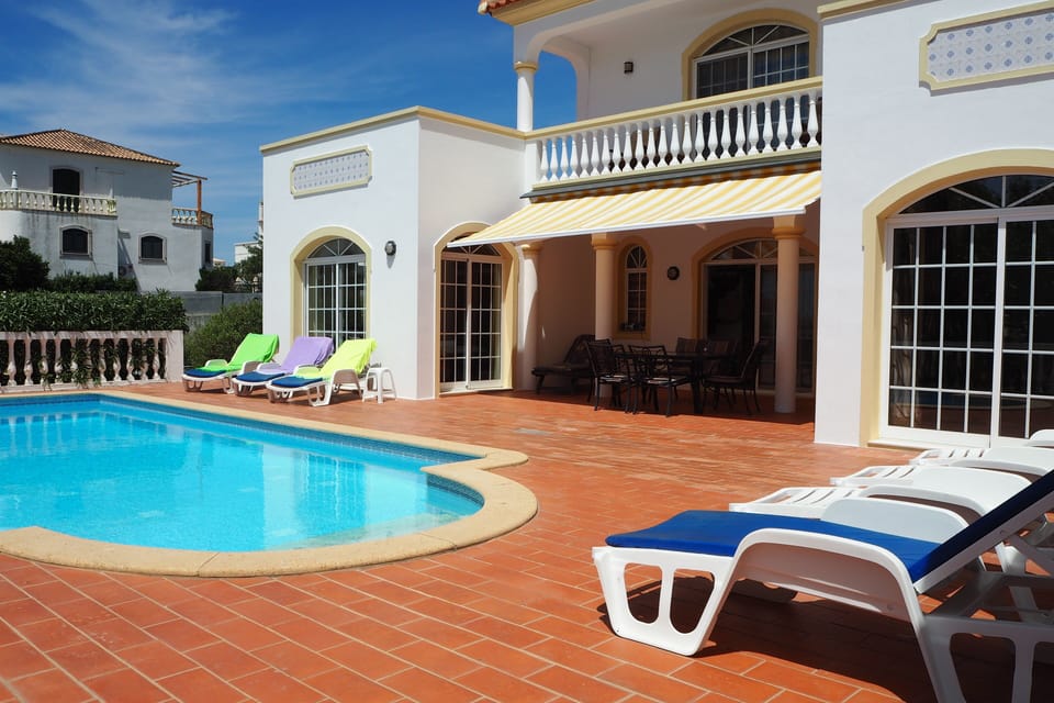 Pool area with 8 sun beds