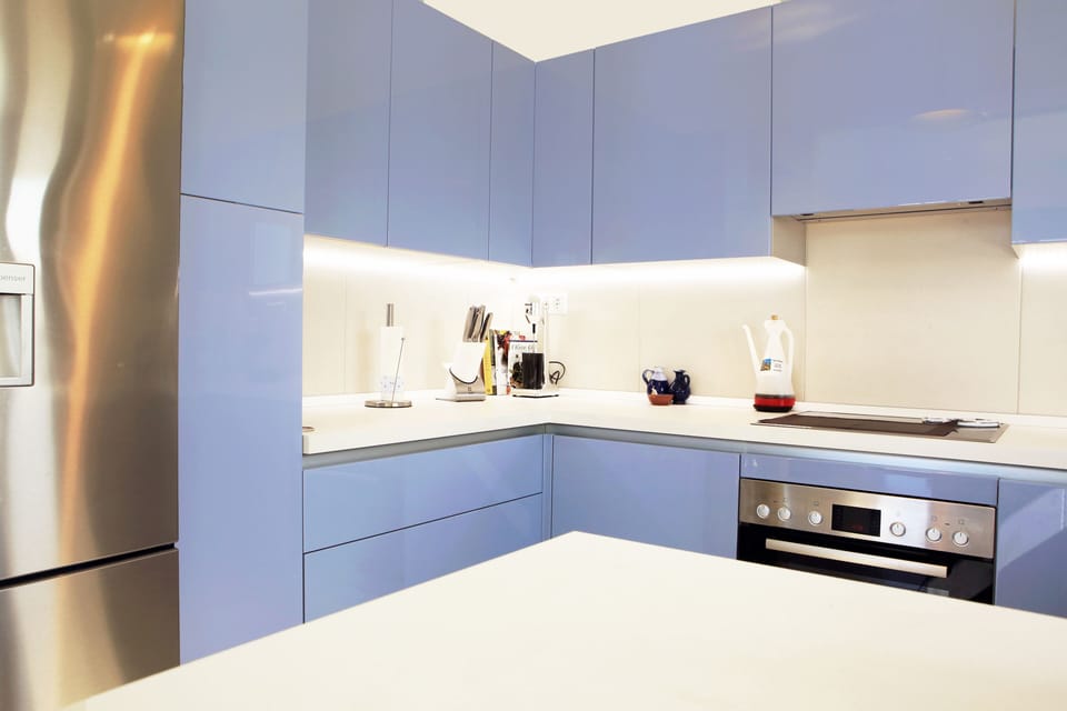 There is a  large fridge-freezer with chilled water dispenser