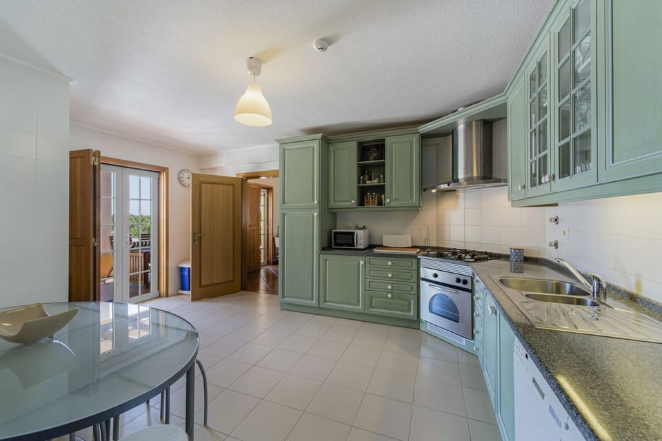 Kitchen with two fridges, one large American type