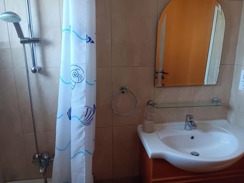 Main bathroom with bath and shower