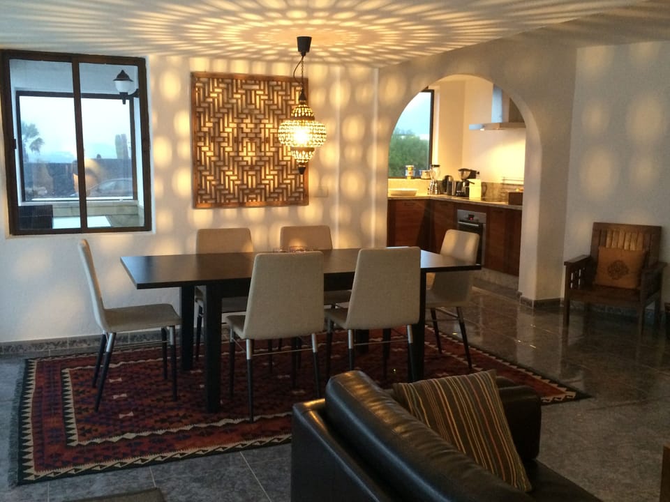 Livingroom with diningtable, looking into the kitchen.