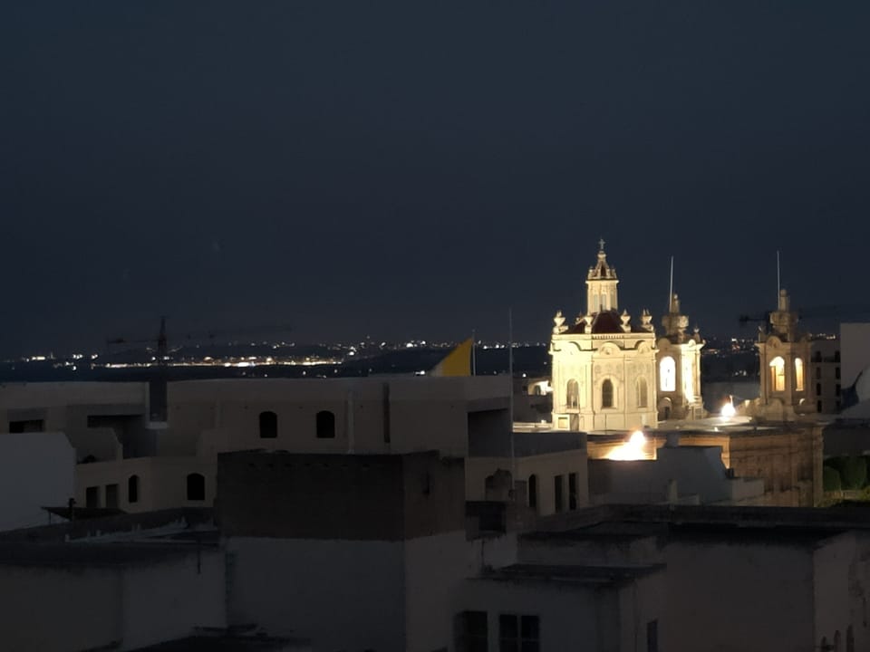 Night view from the balcony.  See the shinning lights on the sister island Malta