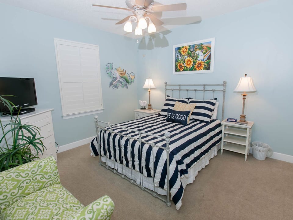 Bedroom 2. Nautical theme with a queen bed.  Cool and relaxing.