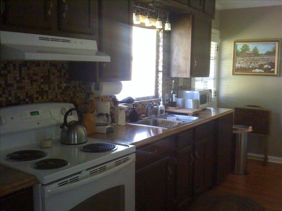 Full kitchen with refrigerator/ice maker and electric stove and  coffee pot
